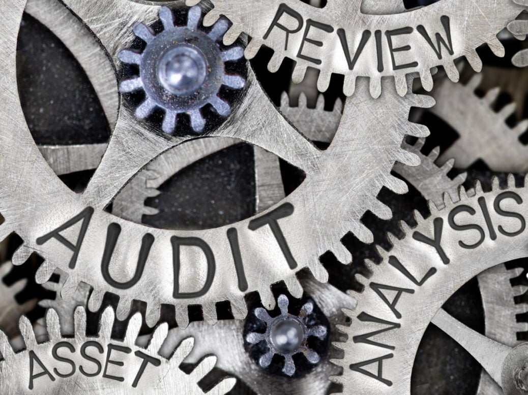 Image shows cogs labelled audit, analysis and review turning together as IESBA broadens PIE definition