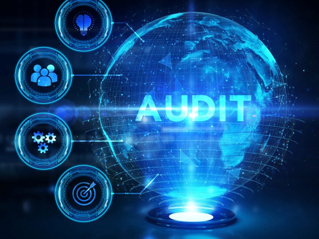 Hologram of the earth with audit written on it