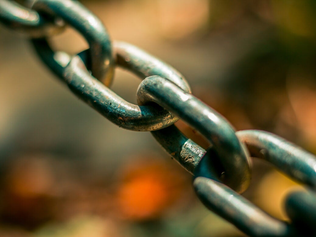 Image of a chain as UK's FRC finds shotcomings in major comanies' modern slavery reporting